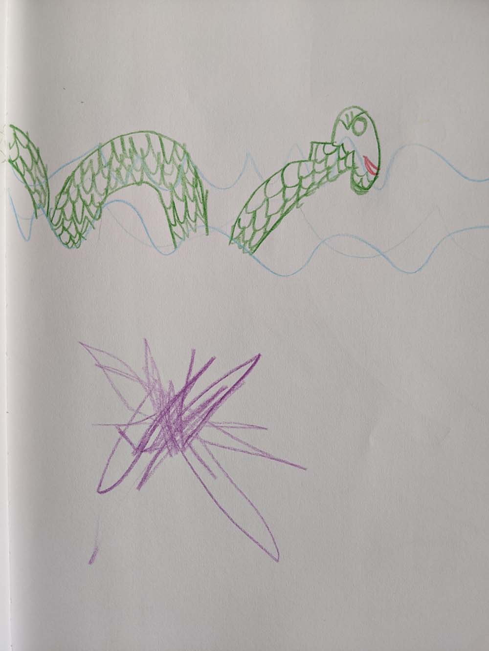 A scaley green sea monster swimming in the water.